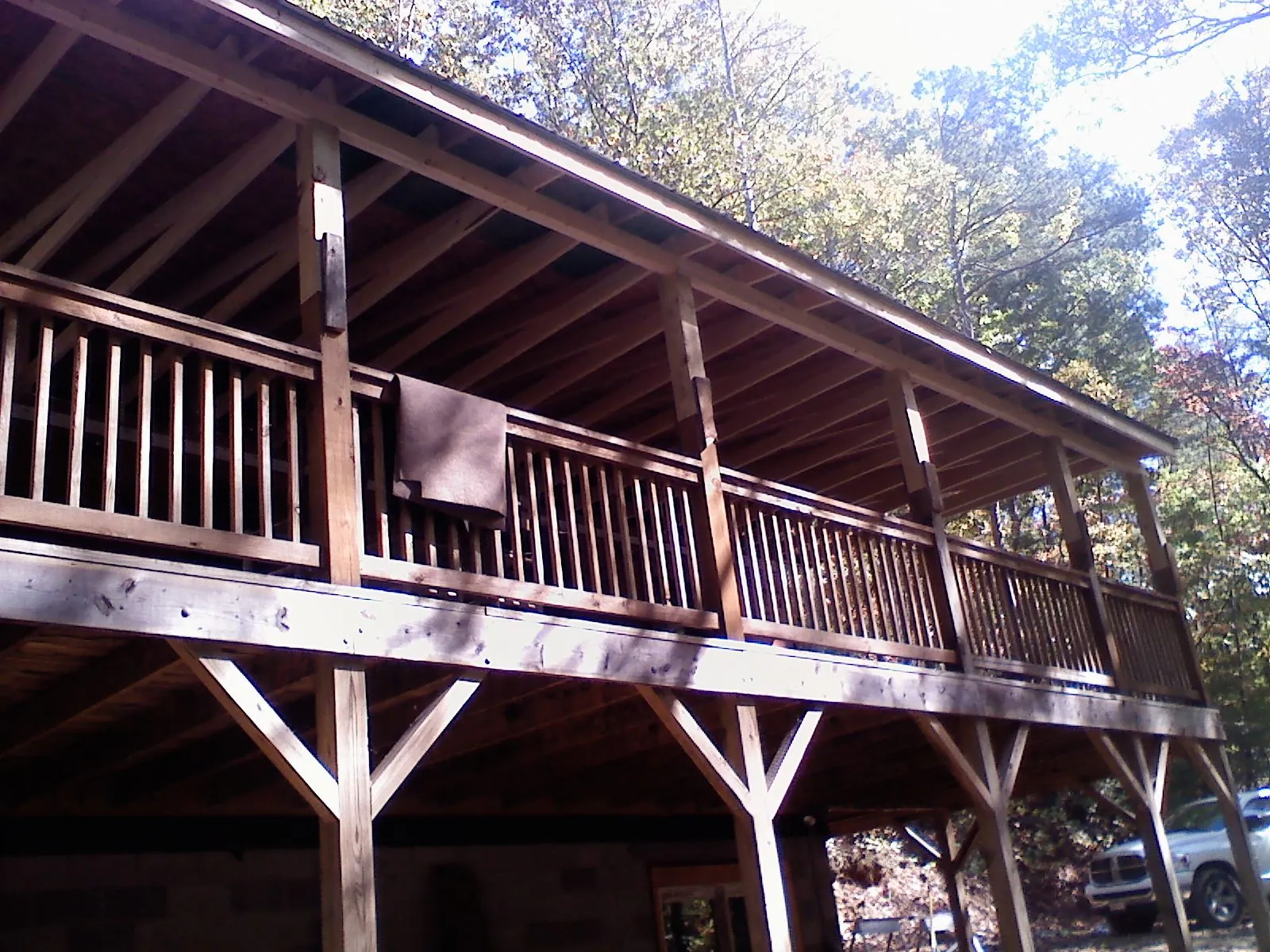 Timber framing under a new elevated porch and deck — Roof Leak Repair in Olathe by Roofing Brothers